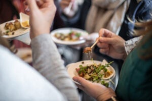 Guests enjoying the menu at a food festival in the Fall - cheddars scratch kitchen closing